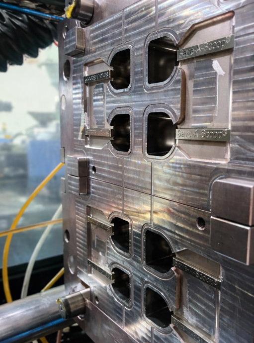 Close-up of injection mold cavities for Save-A-Scoop®